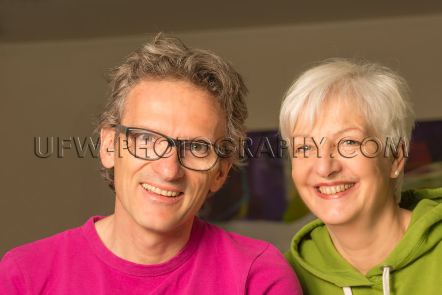 Happy smiling adult couple man woman casual looking gray hair St
