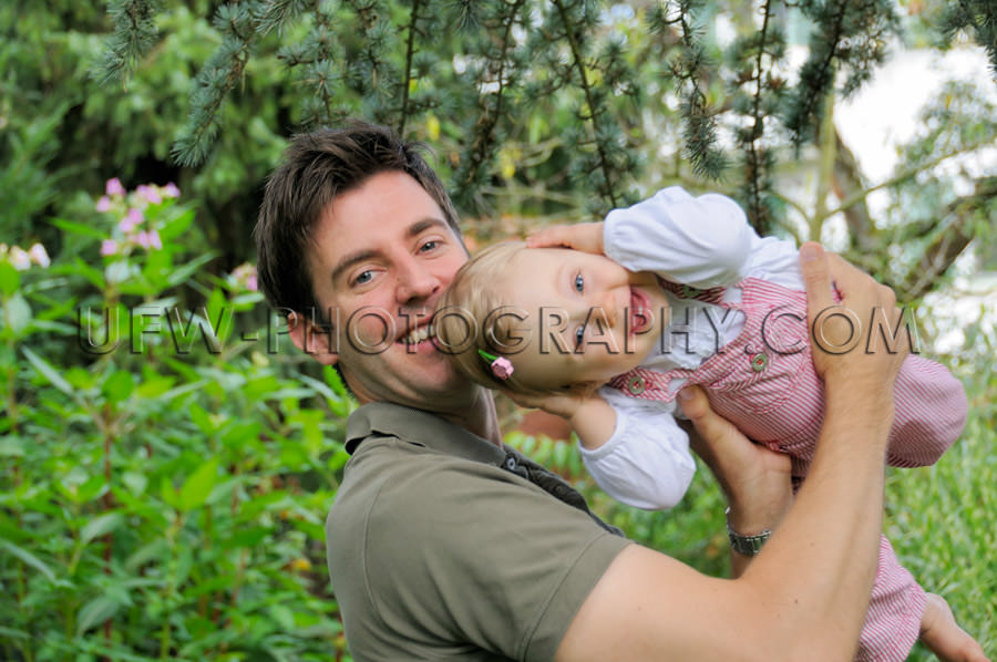 Happy smiling young dad playing little laughing happy daughter g