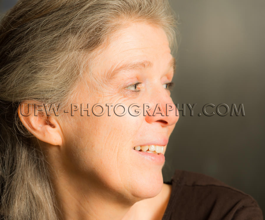 Portrait mature woman toothy smile content candid casual Stock I