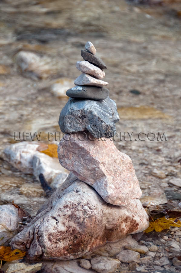 Cairn or mountain pebble stack shore mountain stream Stock Image