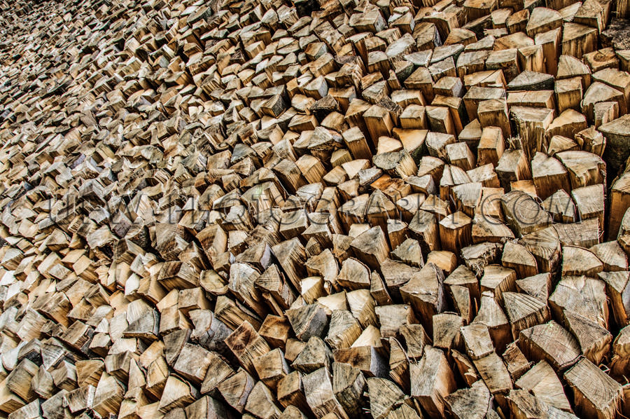 Firewood stack cut chunks endless pile full frame wood energy St