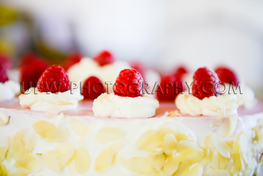 Raspberry cream cake close-up rich decorated full frame Stock Im