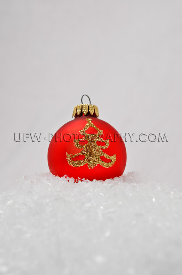 Red Christmas Tree Ball, golden ornament, laying in the snow - S
