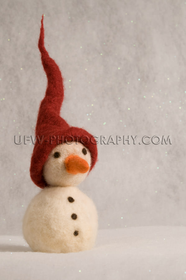 Toy snowman with spiked red hat, carrot nose, coal buttons - Sto