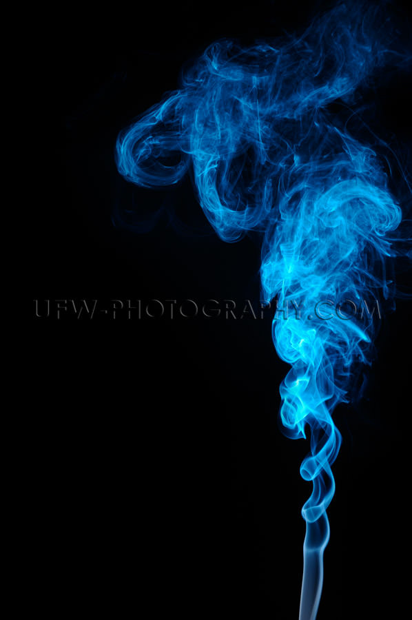 Abstract blue smoke pattern on black background, copy space - St