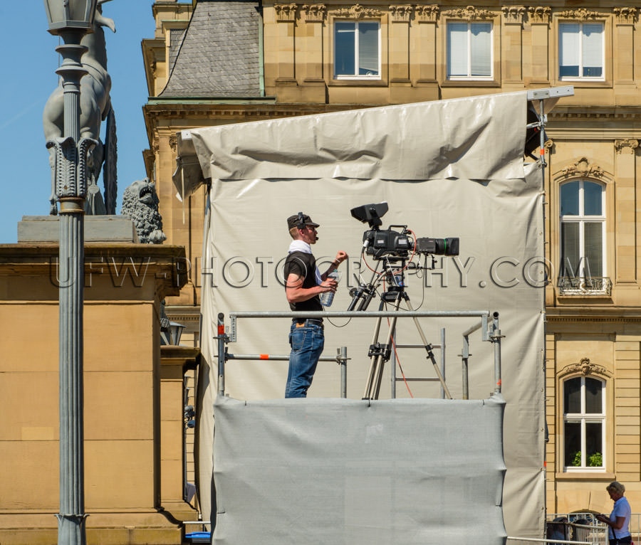 Cameraman tv-camera movie-camera outdoor standing filming Stock 