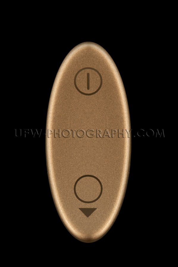 Golden oval switch on off icons macro black background Stock Ima