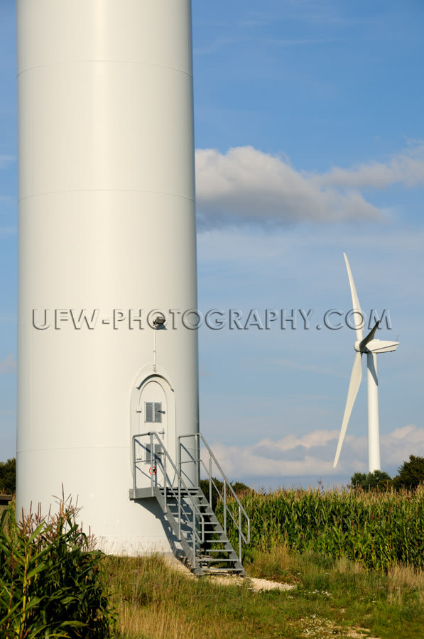 Huge tower base wind turbine staircase door countryside Stock Im