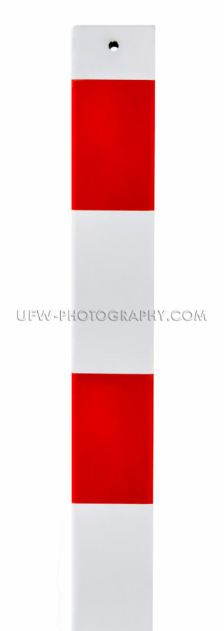 Traffic warning sign Red and white metal barrier post, isolated 