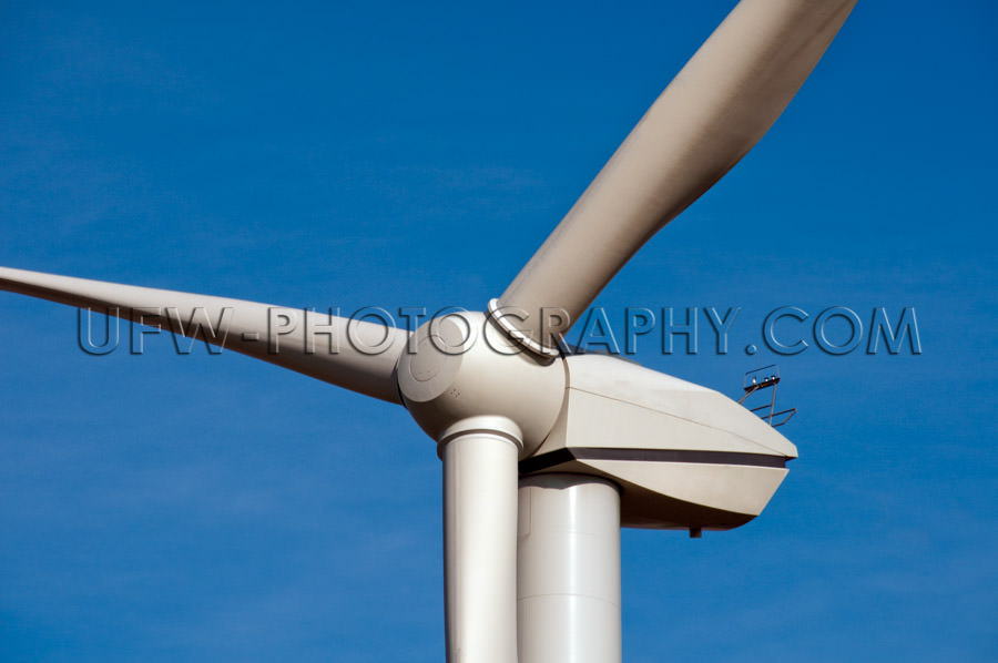 Wind-turbine close-up of blades and generator blue sky Stock Ima