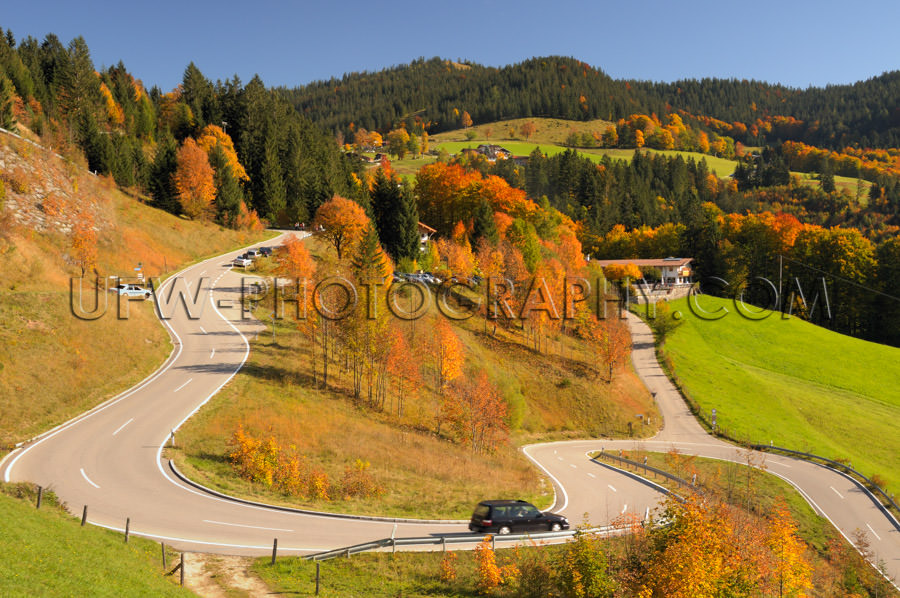 Winding mountain road colorful autumn landscape blue sky Stock I
