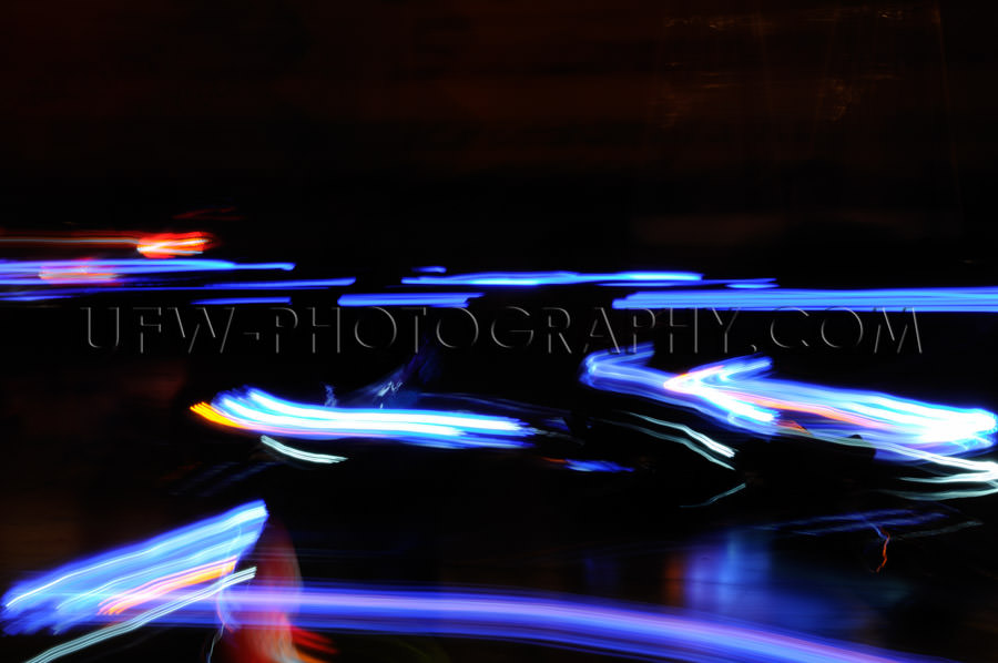 Abstract moving traffic lights red white blue motion blur Stock 
