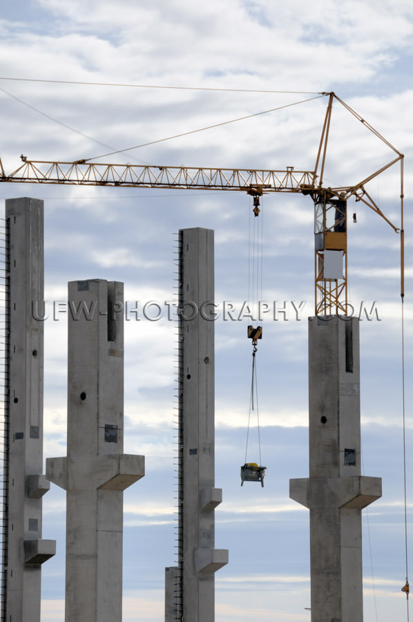 Construction site prefabricated concrete pillars tower crane Sto