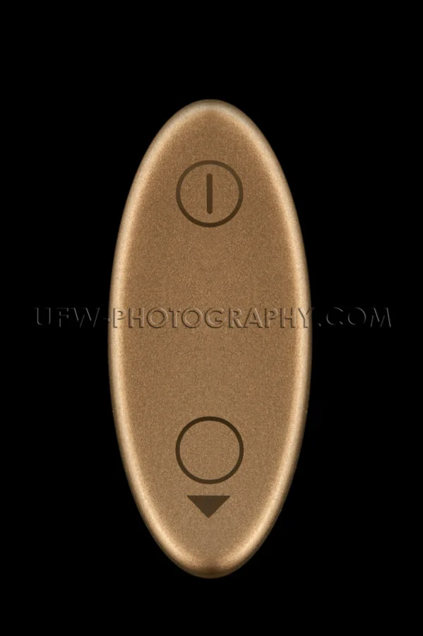 Golden oval switch on off icons macro black background Stock Ima