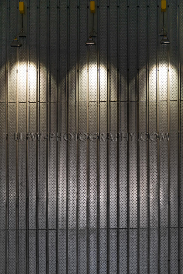 Metal wall illuminated spotlights abstract modern interior Stock