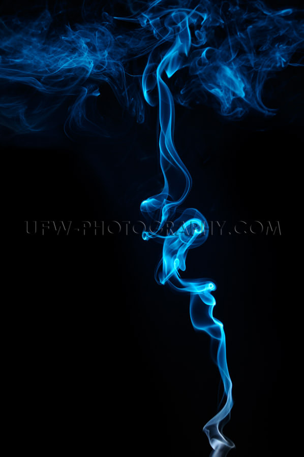 Thin blue abstract smoke ascending, copy space - Stock Image