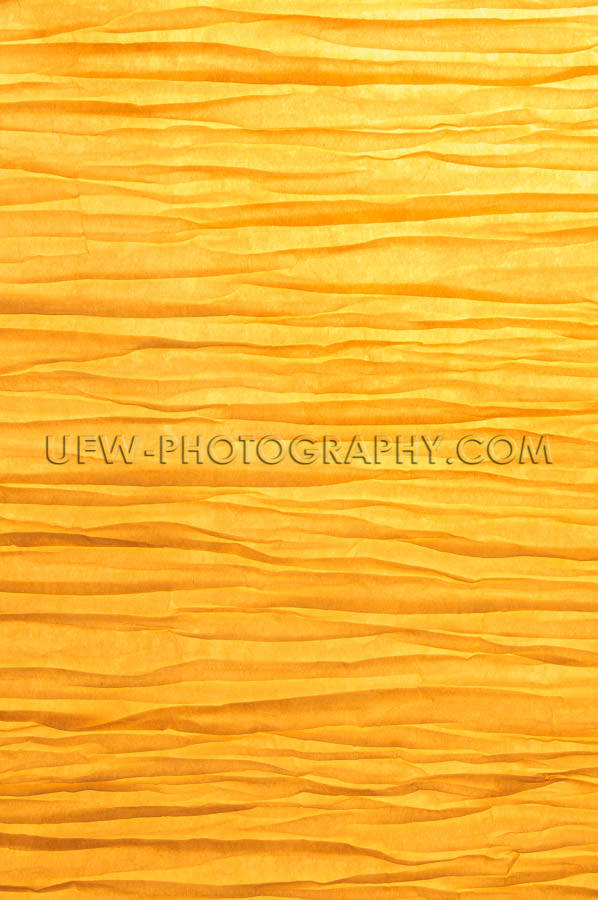 Zen-like wrinkled paper background backlit golden light Stock Im