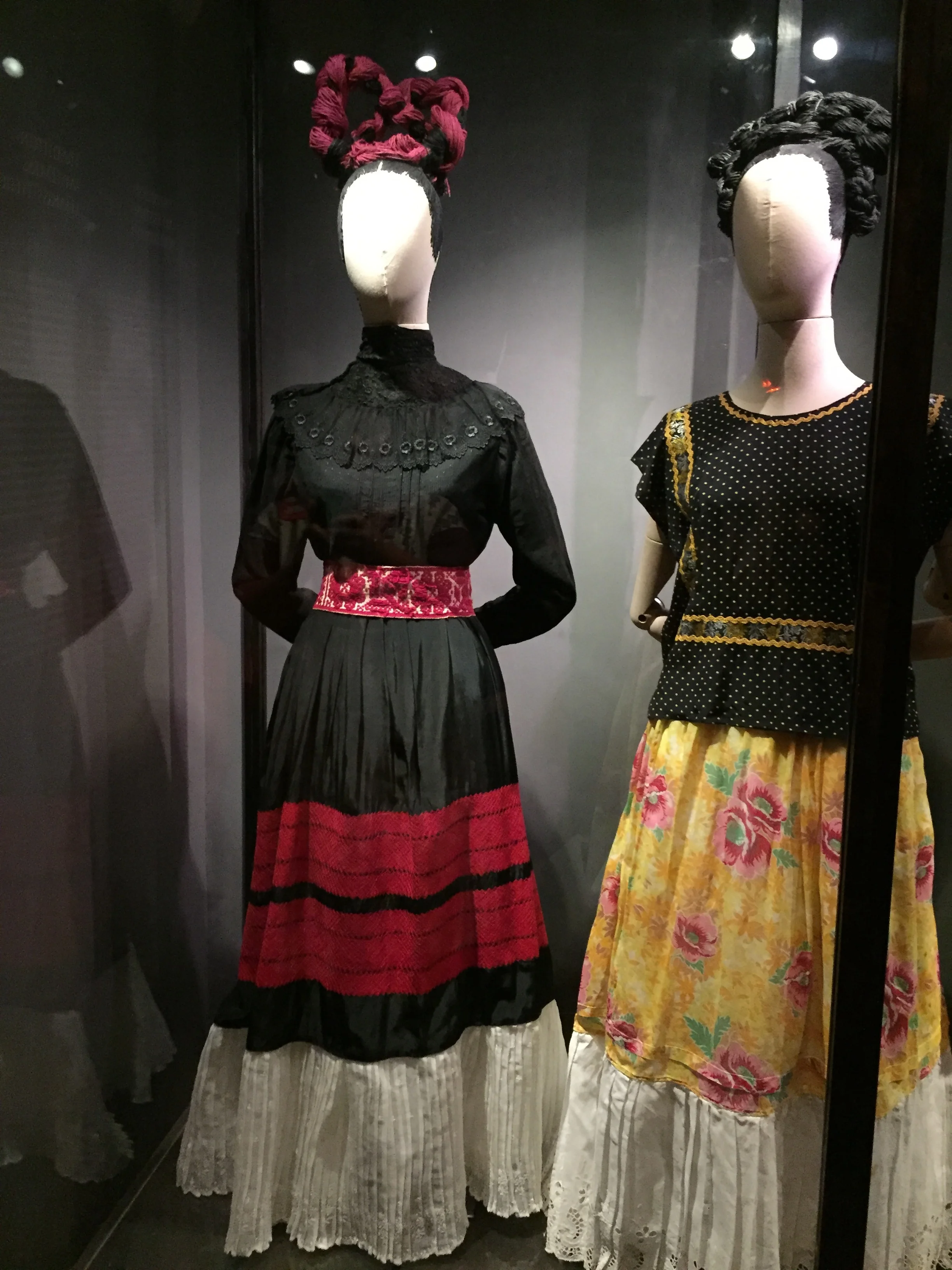  FRIDA EMBRACED HER MEXICAN HERITAGE AND SHOWED HER LOVE OF IT BY DRESSING IN TRADITIONAL ATTIRE. HER CLOTHING ALSO CAMOUFLAGED HER DISABILITIES RESULTING FROM AN ACCIDENT SHE WAS IN AS A TEENAGER. 