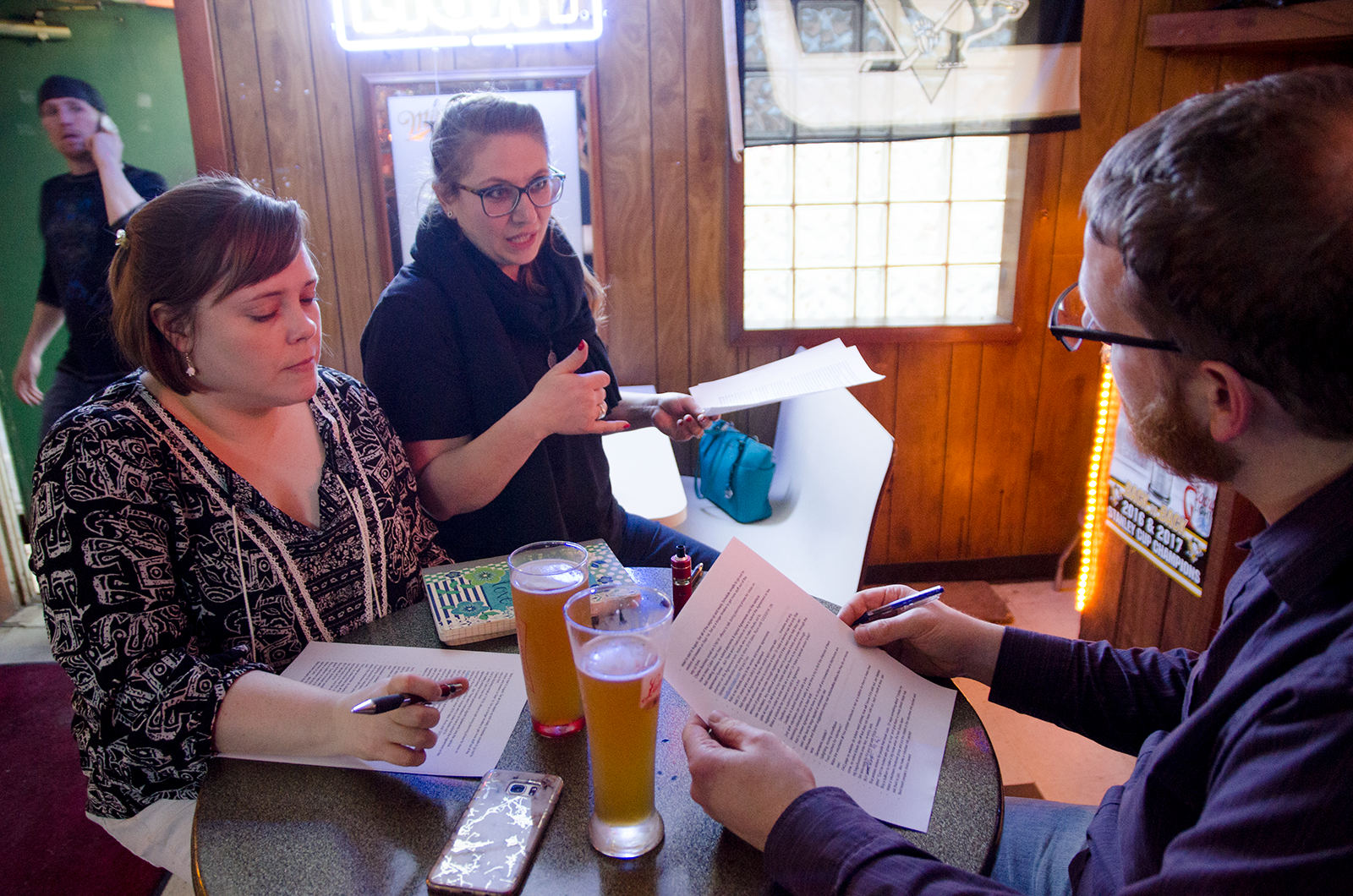 Kristina debriefing with two core volunteers after the 2018 Cabin Fever Festival.