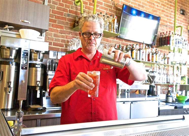 Per Flood rocking the bar at Snooze. Photo courtesy of Westword