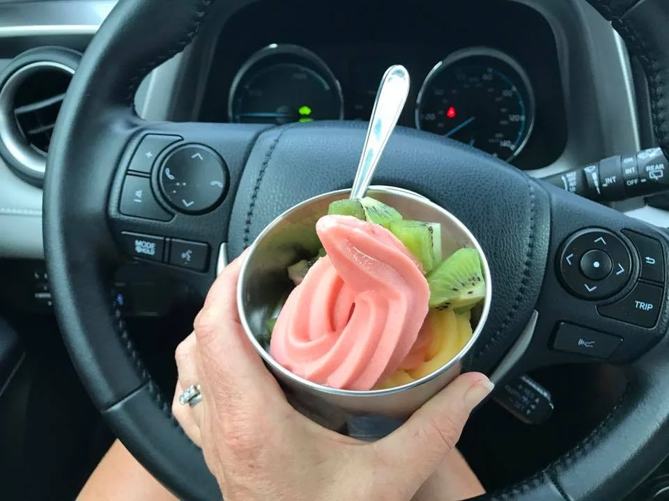 Enjoying frozen yogurt in a reusable dish.