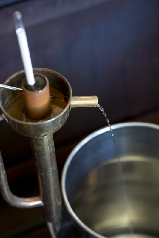 Alcohol coming off of the still.