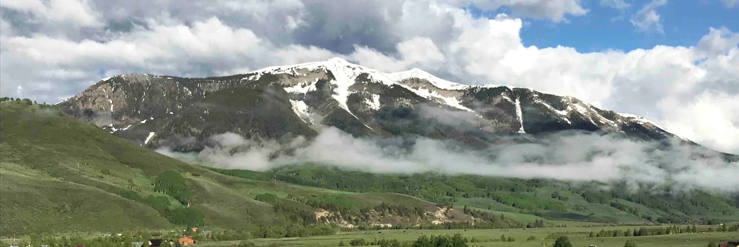 Whetstone Mountain sits above our bottling and distribution center, one of many peaks whose snowmelt contributes to local water supplies and the aquifer we use to proof Montanya Rums.