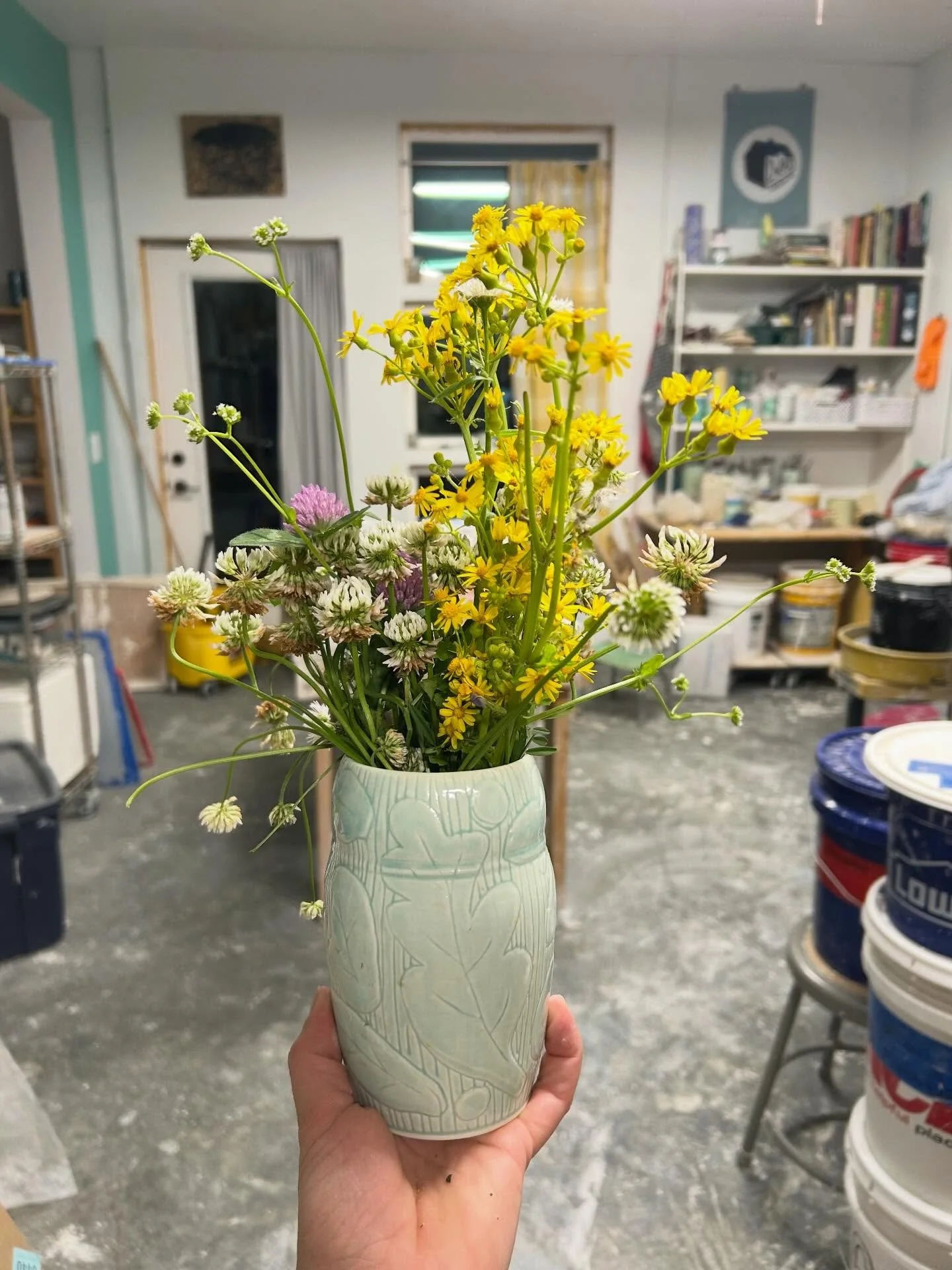 Flowers from my 2 year florist. Studios messy but lots in progress for this weekend! My florist will be hard at work picking flowers for the weekend. Lots of vases and lots of lawn flowers! @shawneehills_potterytrail