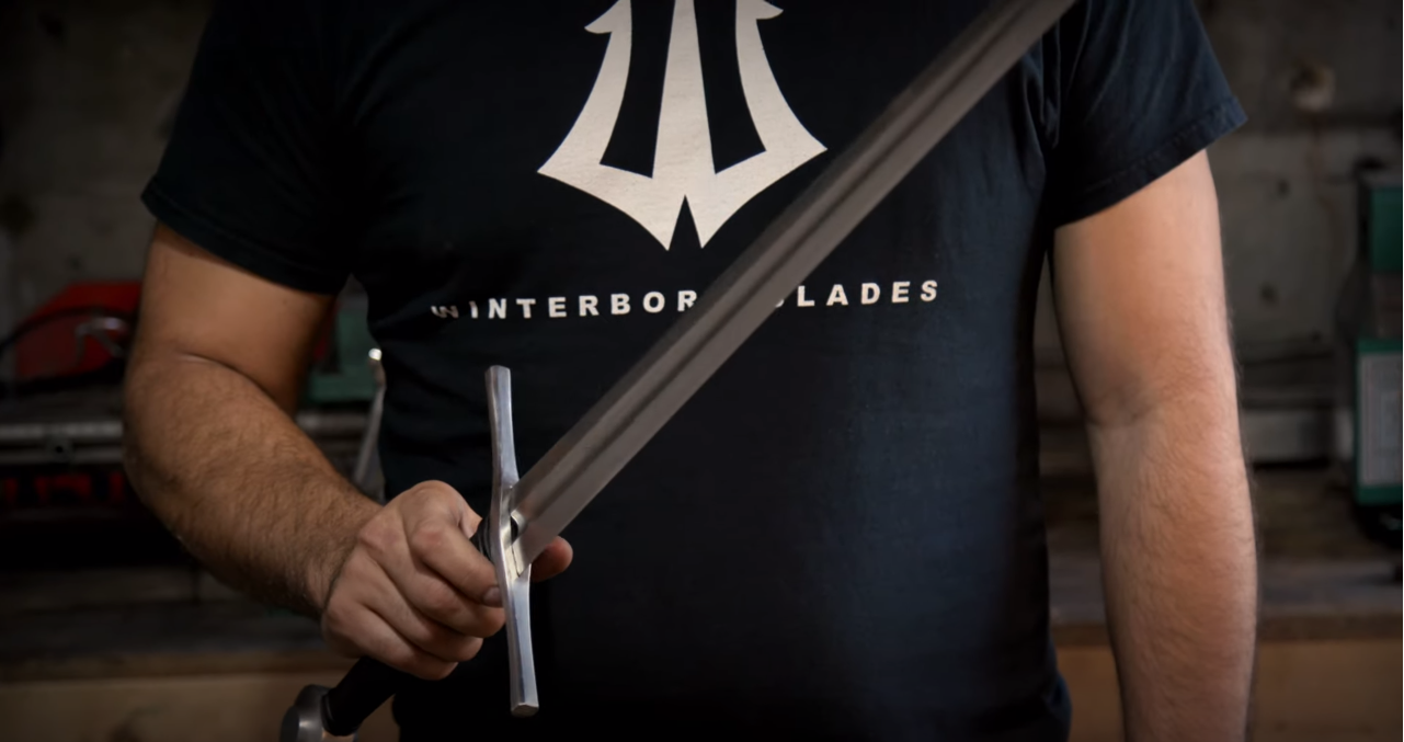 Winterborn-Blades-Process-Bladesmith-Steve-Karakostas-Inspecting-Blade-of-the-Sword.PNG
