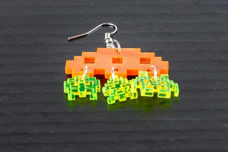 Retro vintage gaming inspired laser cut 8 bit graphic Jewellery Earrings. Cute, simple, iconic and instantly recognisable. Orange and green coloured.