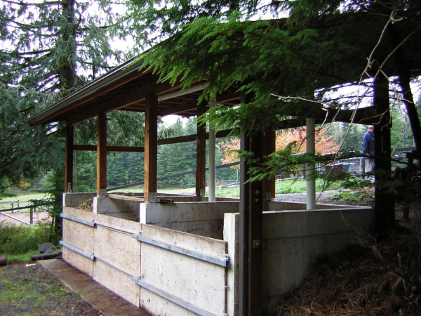 This concrete three-bin system has a permanent roof and removable panels for emptying.