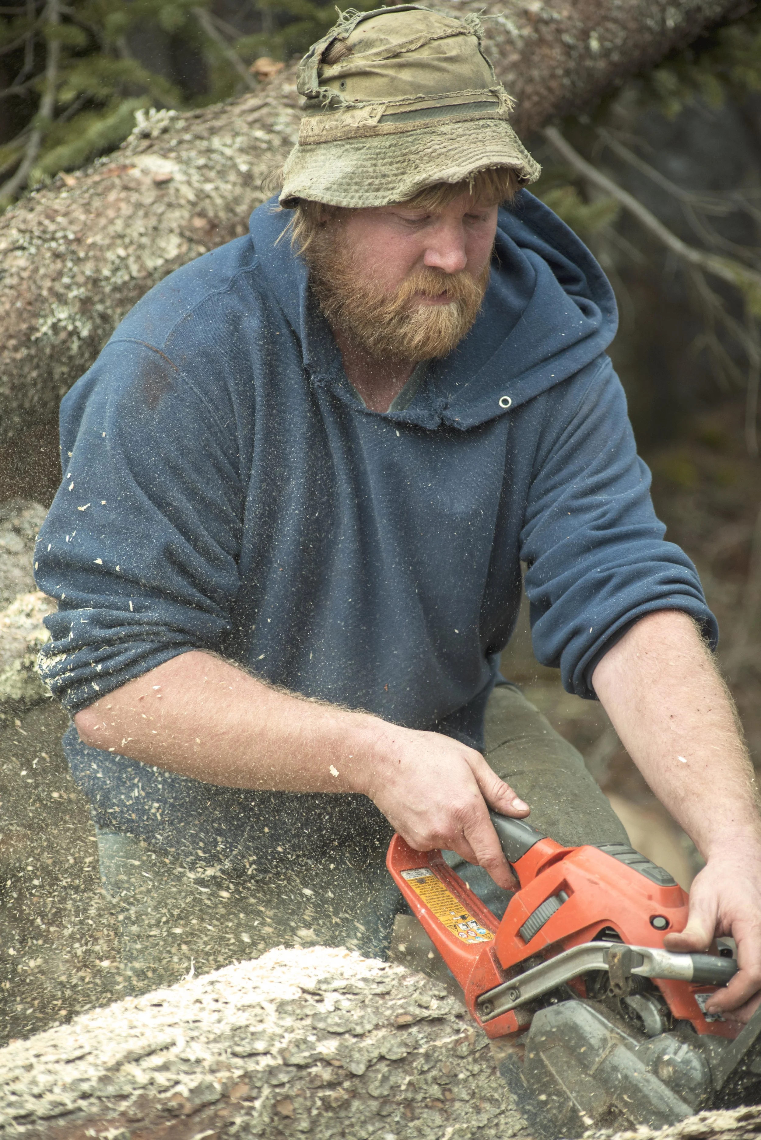 Jeffrey at work sawing...