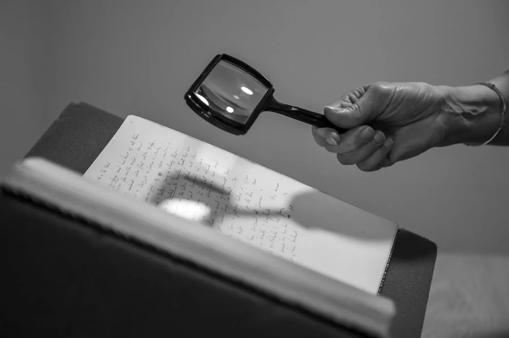 hand and magnifying glass B+W*.jpg