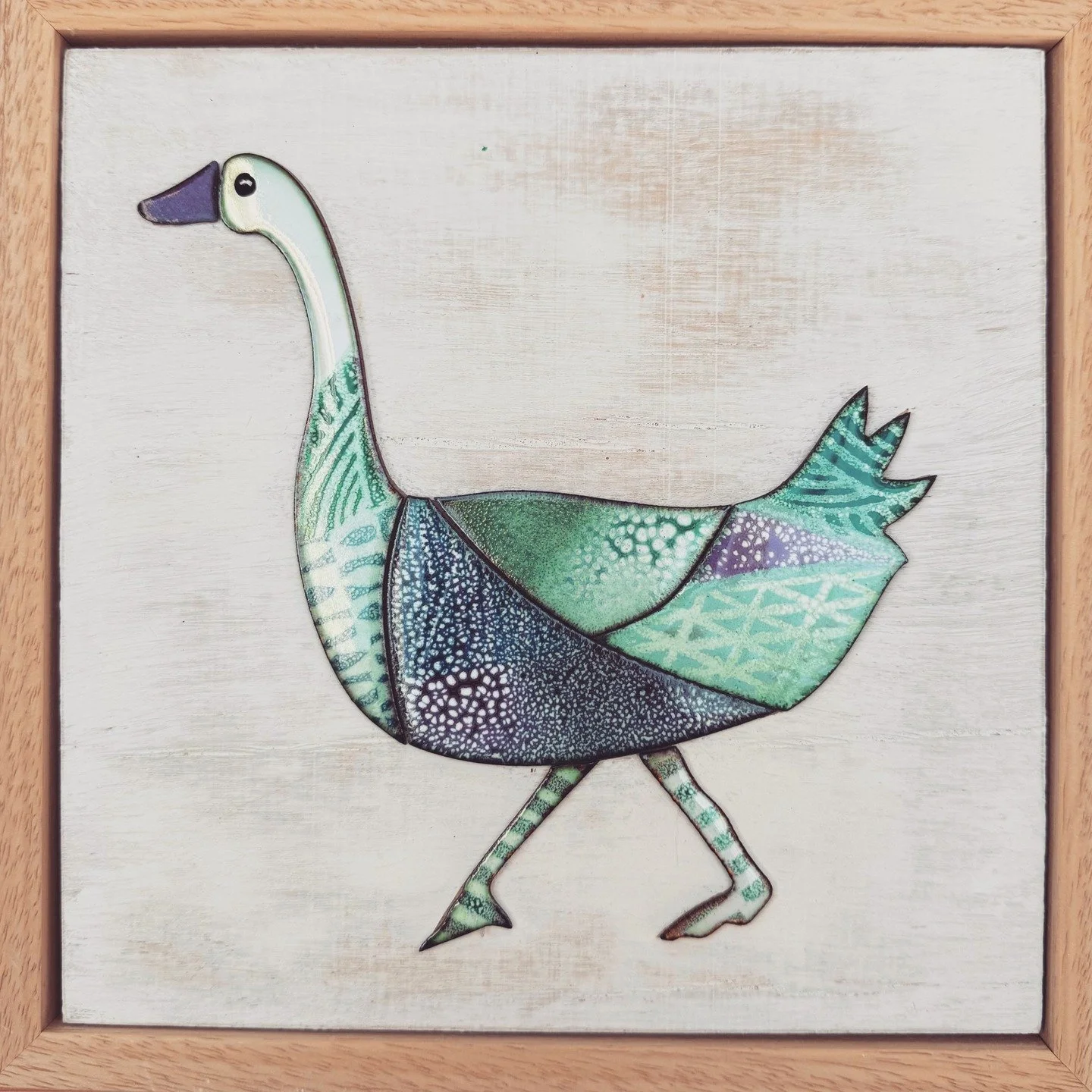 Goose on a Walk. This rather determined looking character is enamelled on copper and attached to a wooden backing board, then framed. She has just stalked off to a lovely new home. Have fun...!

#goose #enamelledgoose #enamel #enameloncopper #illustr