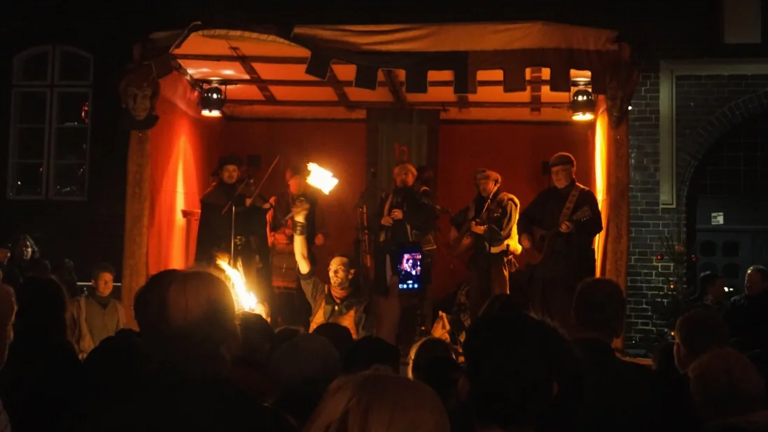 Fire dancers and musicians playing medieval music 
