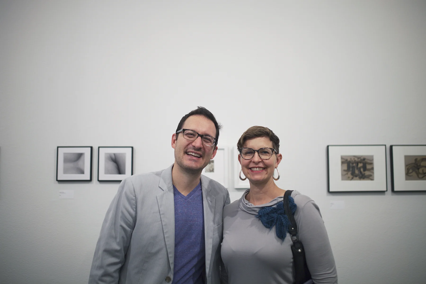 scott b. davis and a lovely lady at the opening reception. (A glimpse of my lumen prints on the right side.) Photo Credit: © Lisa Kimberly