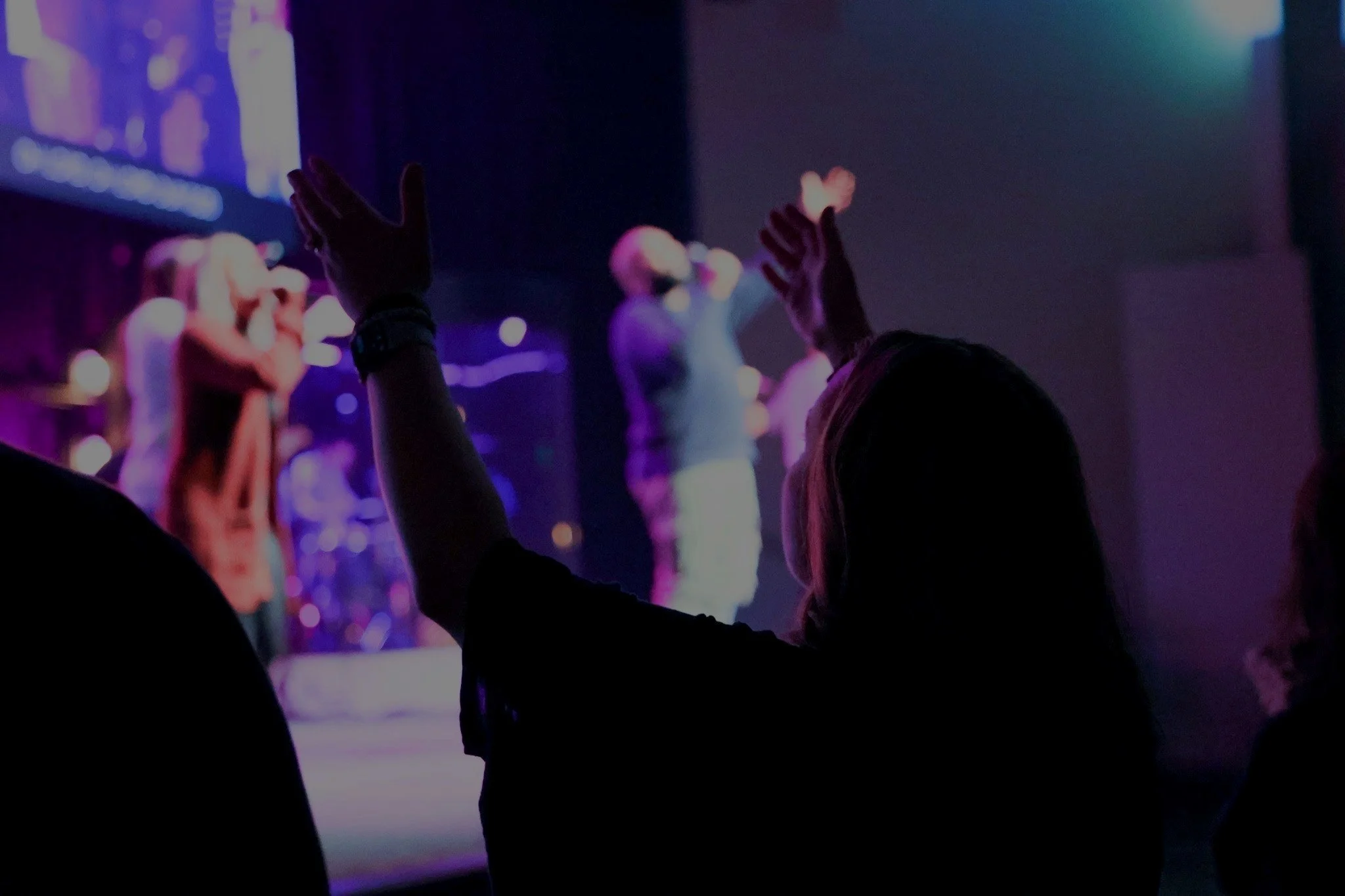 A woman worshipping during our Sunday service.