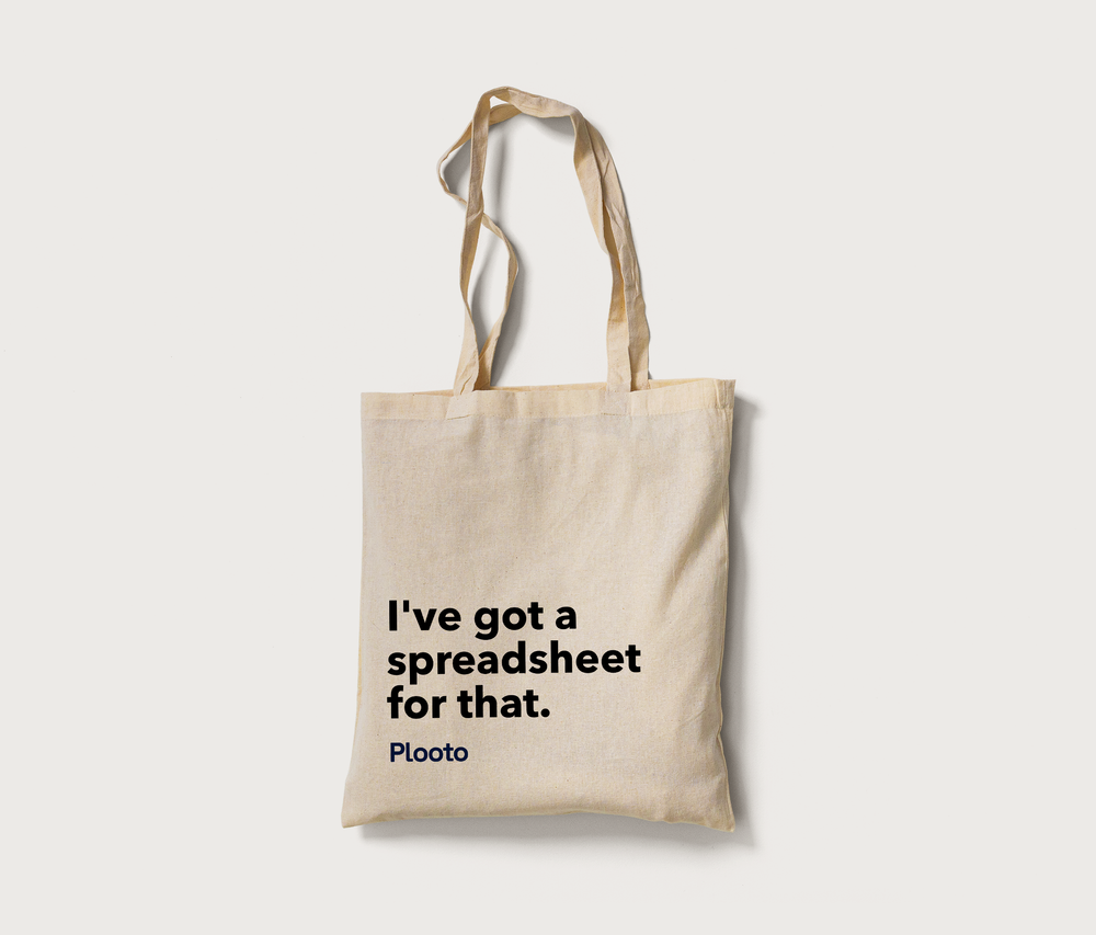 Beige tote bag with black text that says, "I've got a spreadsheet for that." and smaller text that says, "Pluto."