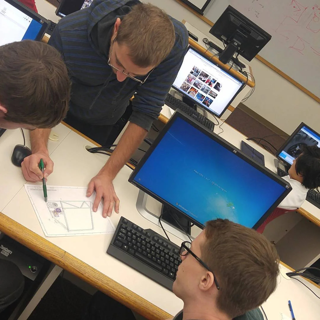 Jaryd, Patrick and John discussing the rear frame