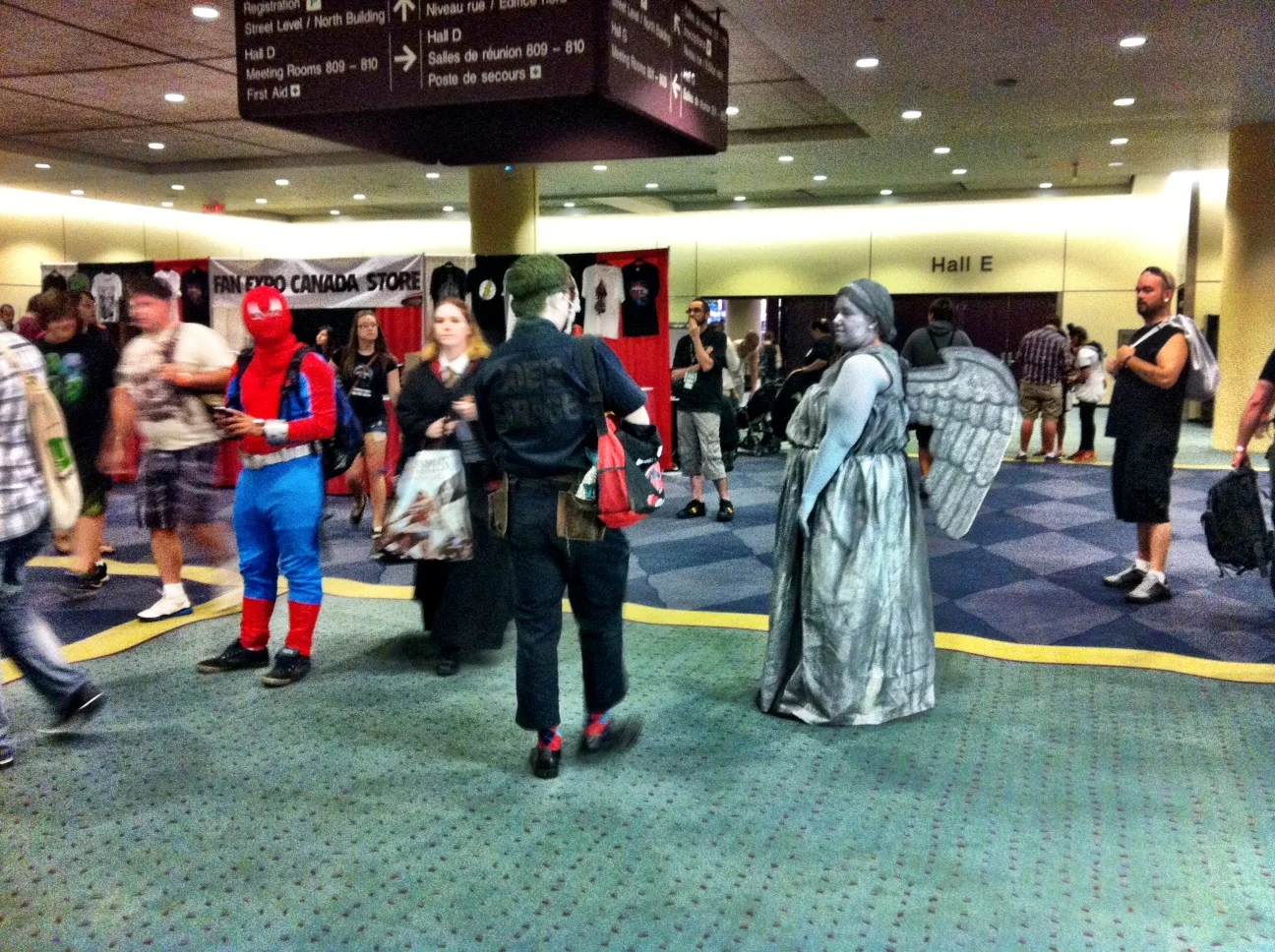 These are the simpler costumed fans and I waiting to use the washroom (how you get into a stall with those wings on is beyond me. Back in maybe? Door left open is an option…)