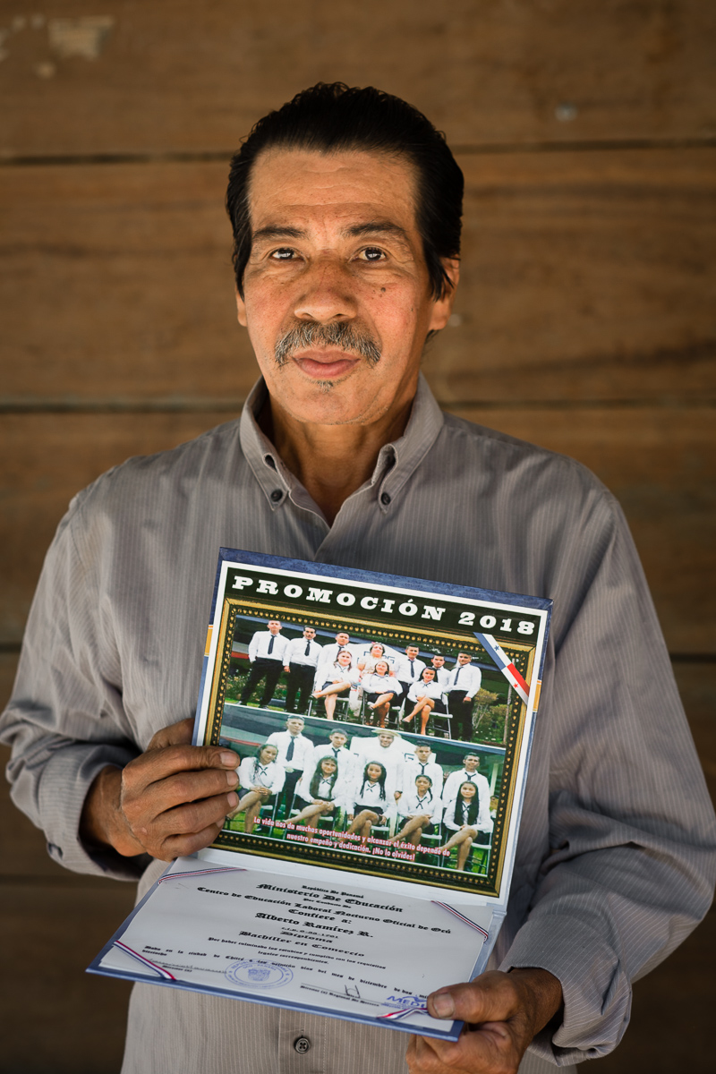 Beto, age 55, displays his high school diploma. The next village over, a 60 minute walk away, now offers night classes for adults to complete their primary and secondary studies.