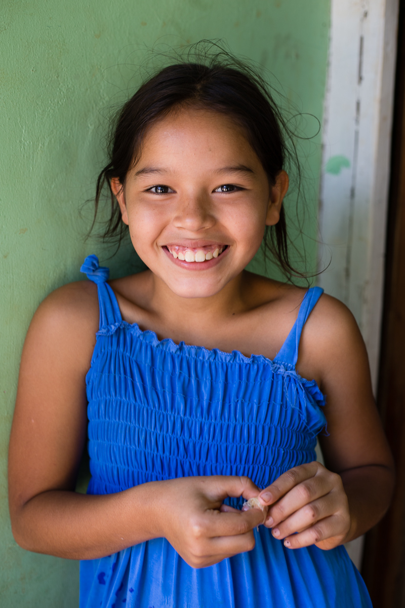 Noemi, outside her cement home, in 2019.