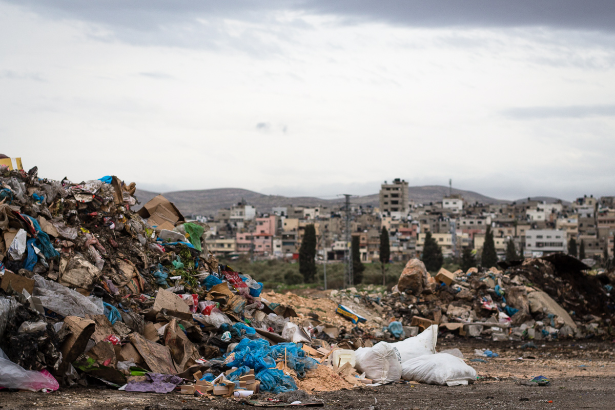 Trash collected by the Palestinian Authority. In the background, the largest of 4 refugee camps in Nablus.