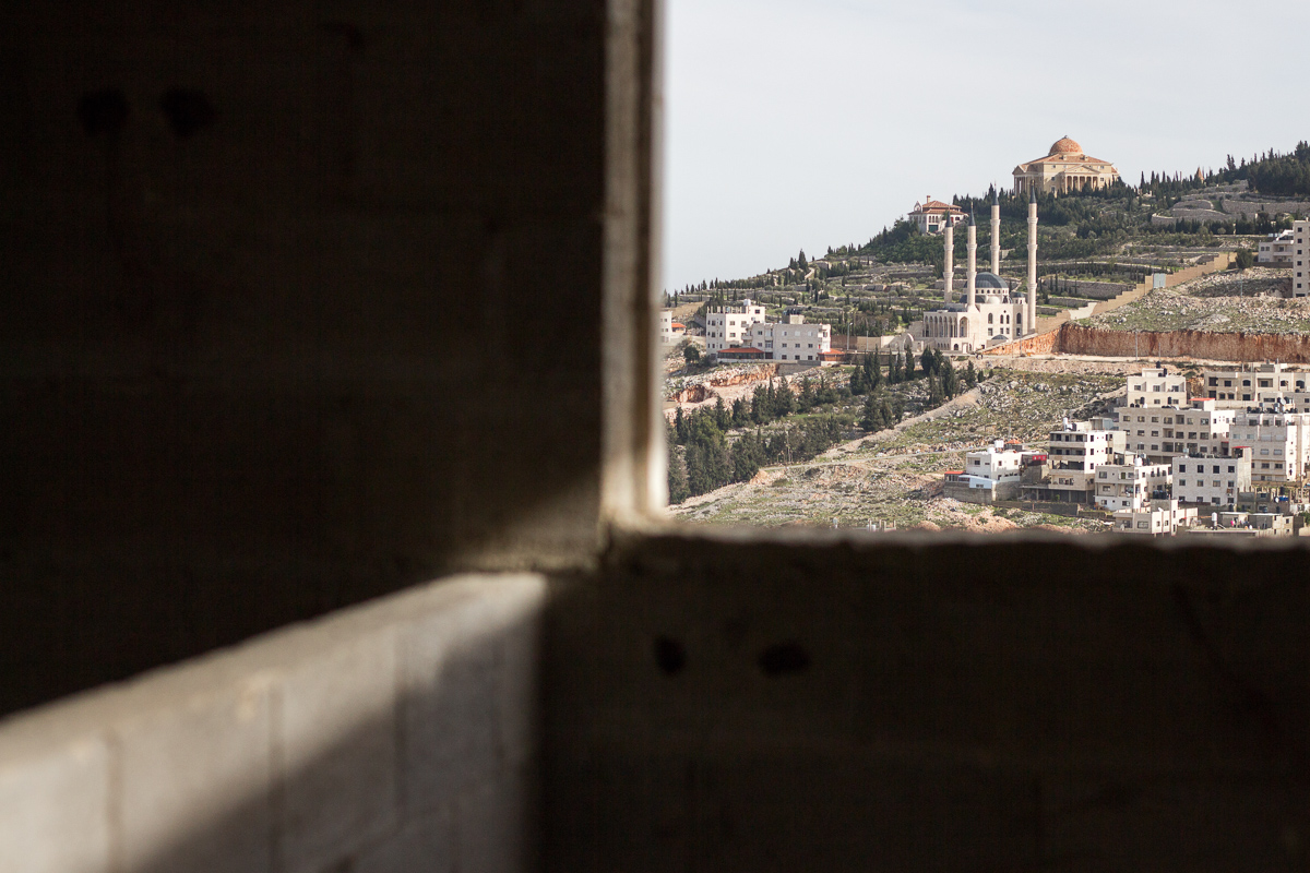 A Samaritan temple and adjacent mosque mark the city’s periphery. On the other side of the hill, an Israeli watchtower and Jewish settlement.