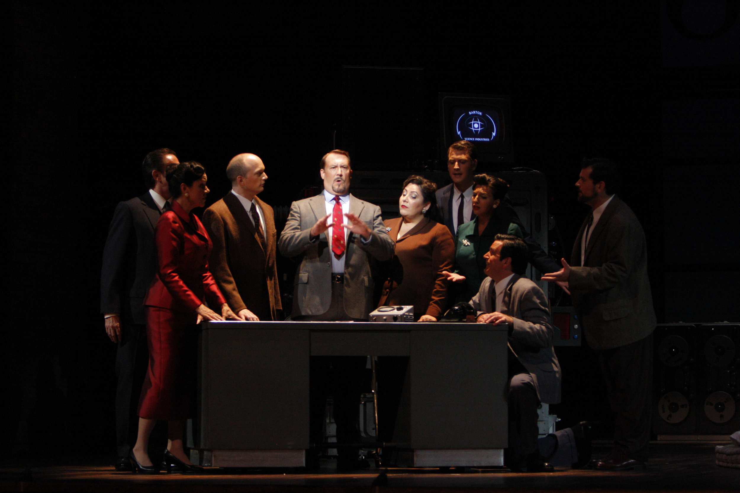 Gary Lehman (center) as Stathis Borans in The Fly. Photo by Robert Millard for the Los Angeles Opera, 2008
