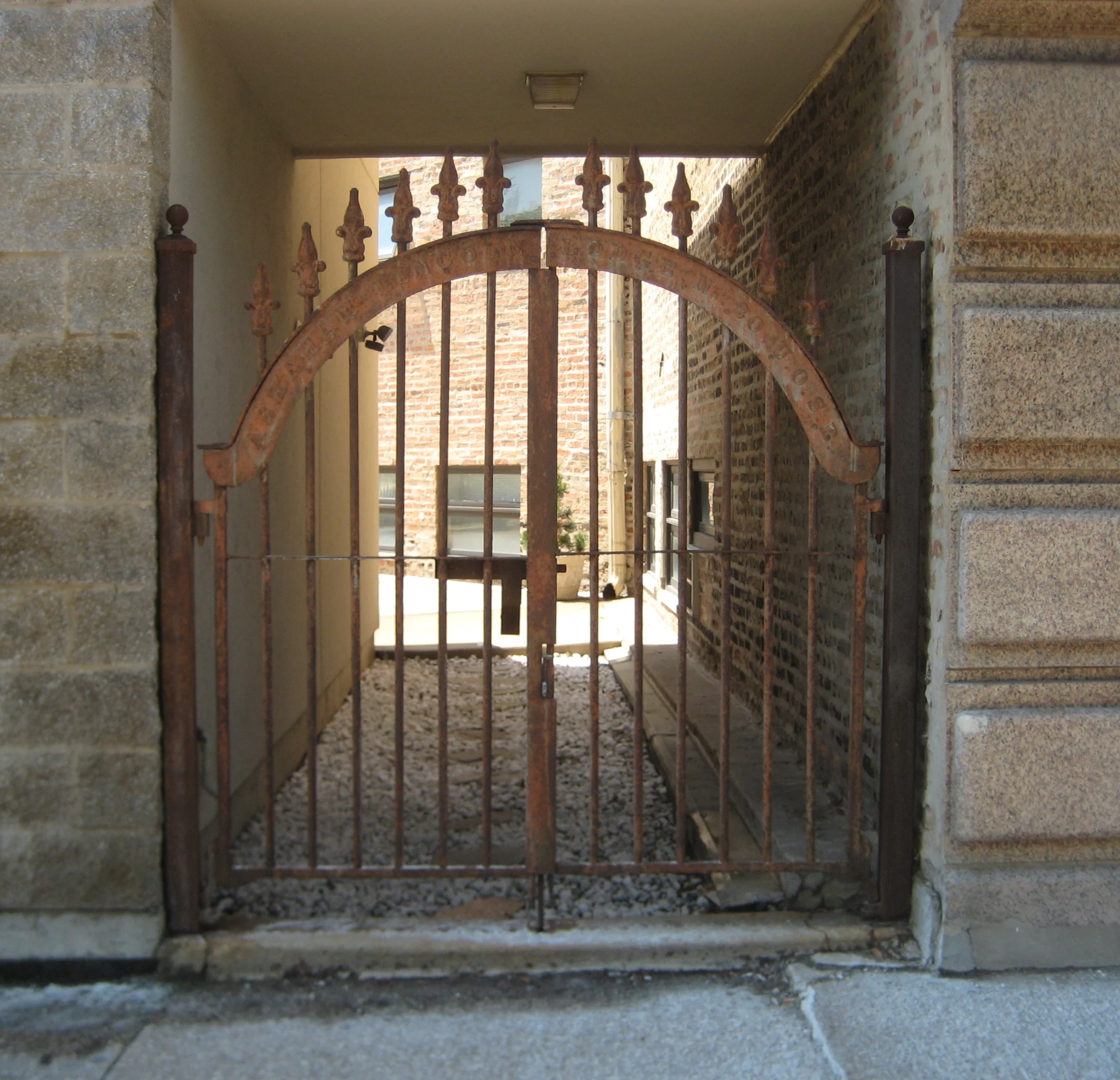 The Abraham Lincoln lodge gate between the two buildings (facing Milwaukee avenue) is from New York, NY and is from a Jewish section of the lodge - most likely why the UOSB is the German version of the letters of the IOSB (The Independent Order Sons of Benjamin) . Here is a document from The Supreme court dated June 20, 1890 that refers to it. The WTTW "Ask Geoffrey" segment describes the gate as part of "The Independent Order of Odd Fellows".