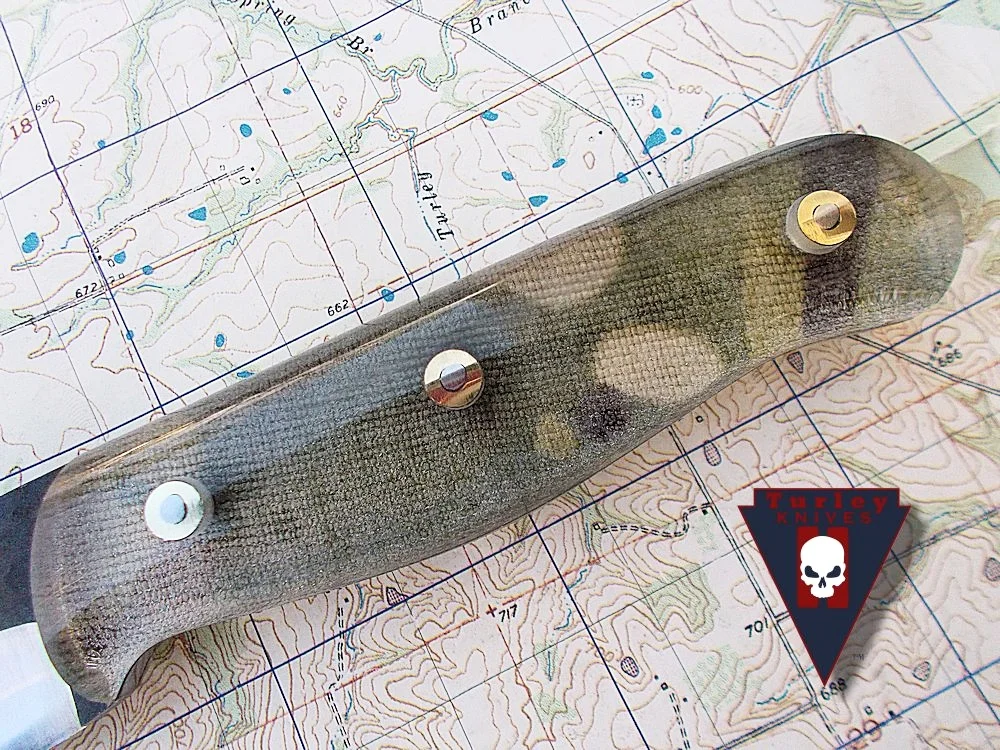 Multicam fabric underscales (pretty much any camouflage you can imagine can be used. The type of fabric used determines how dark or light the final handle will look. 