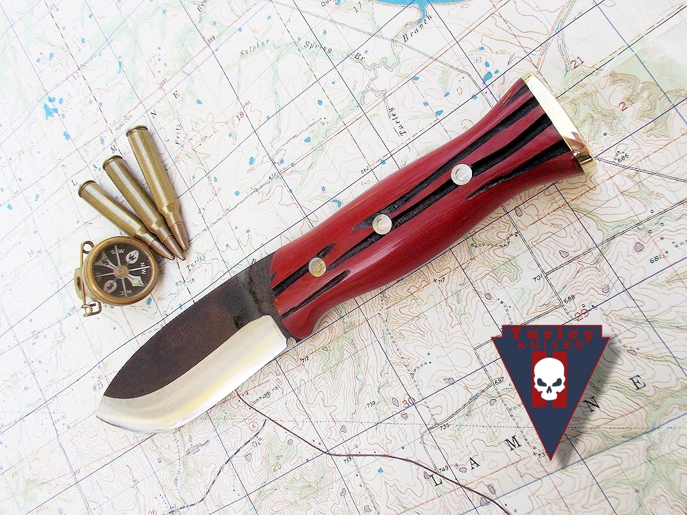 Red linen micarta. Hand jigged scales.