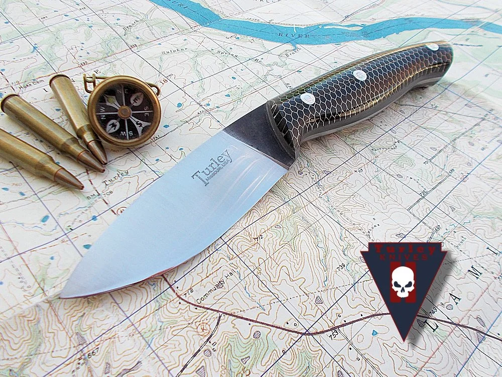 M11 with full height grind, black c-tek scales, 1/8" gray g10 spacers, stainless loveless bolts