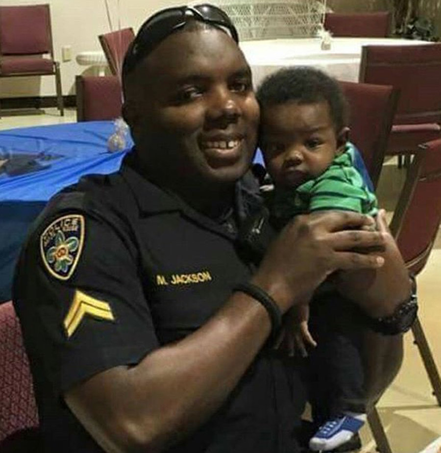Officer Montrell Jackson and his newborn son.